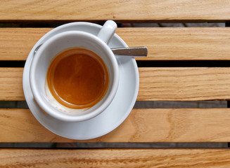 hot Italian espresso coffee on wooden table background, space for text