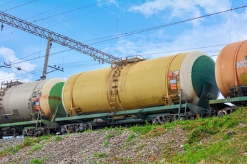 Set of tanks with oil and fuel transport by rail. Railroad Cargo train