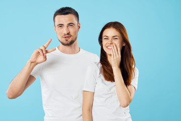 Wall Mural - young couple in t-shirts chatting