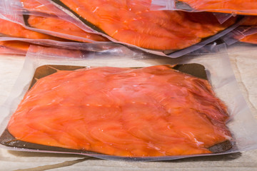 red fish in a sealed vacuum plastic bag. finished product from production