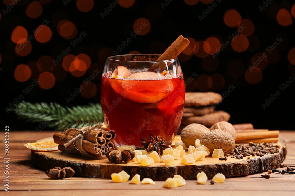 Glass of tasty mulled wine on table