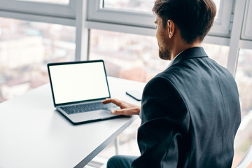 young man working on his laptop at home