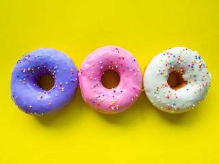 Donuts various flavor have color Orange White Purple Pink,High energy foods and healthy rates,Sweet flavored candy,Mapping background