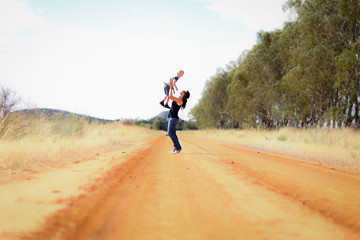 Wall Mural - Mother and son mucking around on country road in Central Victoria, Australia