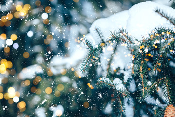 Christmas tree outdoor with snow, lights bokeh around, and snow falling, Christmas atmosphere.