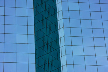 Office building glass facade with reflection