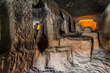 Wall Mural - Unfinished monastery (vihara), cave 24, carved into a cliff in Ajanta, Maharasthra state, India