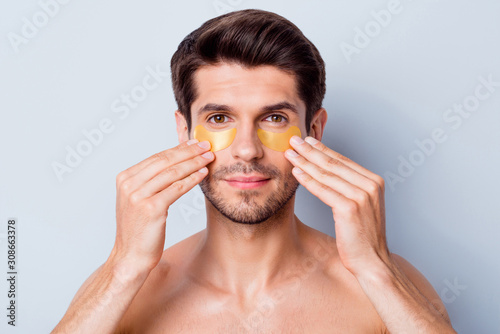 Cuadros en Lienzo Close-up portrait of his he nice attractive bearded brunette guy applying using