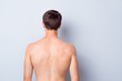© deagreez - Back rear side photo of handsome man stand feel cool after men spa salon treatment procedure isolated over grey color background
