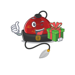 Wall Mural - mascot cartoon of happy traditional chinese hat with gift box