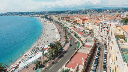 Wall Mural - The public baths Plage de Castel and Plage des Ponchettes in the French city of Nice with the well known promenade quai des etats Unis along