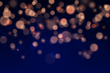 Wall Mural - bokeh lights effect on blue background. vector christmas glowing yellow and orange overlay sparkle t