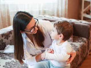 a doctor and a small child. first meeting with a doctor. doctor at home. call at the address.