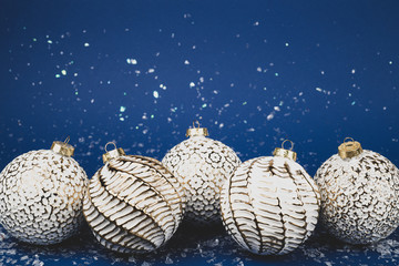 Christmas white balls on a blue background.