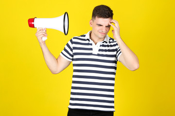 Sticker - Young man with megaphone on yellow background