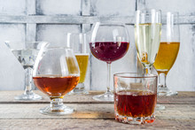 Selection Of Different Alcoholic Drinks - Beer, Red White Wine, Martini, Champagne, Cognac, Whiskey In Various Glasses