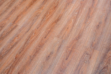 Sticker - The floor of the light brown laminate diagonally