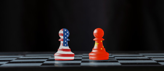 Wall Mural - USA flag and China flag print screen on chess with black background.It is symbol of tariff trade war tax barrier crisis between United States of America and China.-Image.