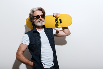 Portrait of a handsome stylish mature man wearing a vest