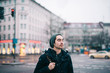 © Viktor Pravdica - Young man standing in the street while snowing