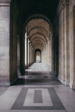 Vertical Shot Of An Outdoor Hallway Of A Historic Building With Outstanding Architecture
