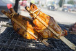 Two yellow roast chicken in Street Food in Thailand