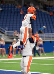 Great action photos of football players making amazing plays during a football game