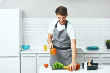 man cooking in kitchen