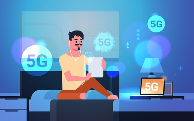 Poster - man using tablet listening audio book 5G online communication fifth innovative generation of internet connection guy sitting on bed modern bedroom interior horizontal full length vector illustration