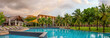 © Vladimir Razgulyaev - Panorama of the chic five star hotel with pool the sands of katathani. Evening order, palm trees and green grass. vacation spot
