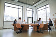 © Flamingo Images - Diverse businesspeople smiling and talking together during a boa