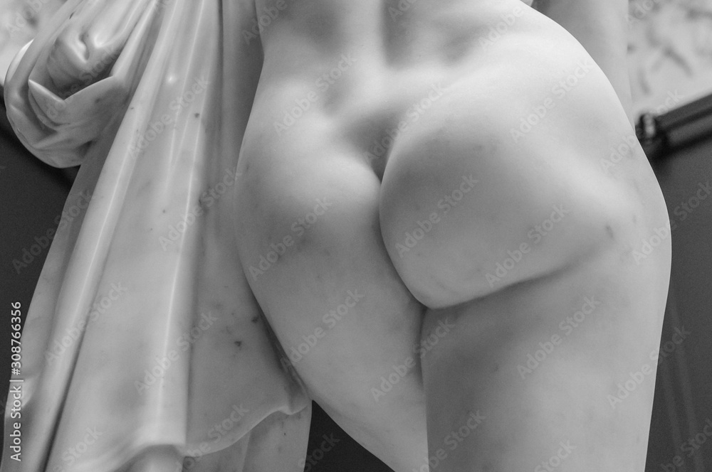 Antique marble woman ass sculpture. Detail of the butt of the statue of marble with solid buttocks - obrazy, fototapety, plakaty 