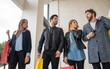 © Lomb - Group of young people walking in the market mall. Youth shop and talk together as they walk through the corridors of a mall. Fashion sales lifestyle concept