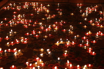 Wall Mural - Bokeh of the candle on the golden mounth