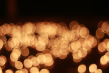 Wall Mural - Bokeh of the candle on the golden mounth