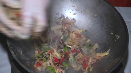 Wall Mural - Cook prepares wok noodles with vegetables