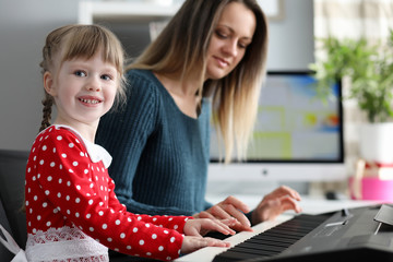 Little kid playing piano