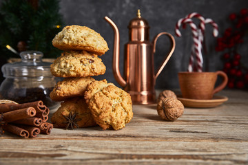 Wall Mural - Christmas treat with cookies hot coffee and candies. Festive card new year decoration on wooden board in rustic style.