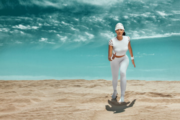 Wall Mural - Sporty young woman and fit athlete runner running on the sky background. The concept of a healthy lifestyle and sport. Woman in white sportswear.