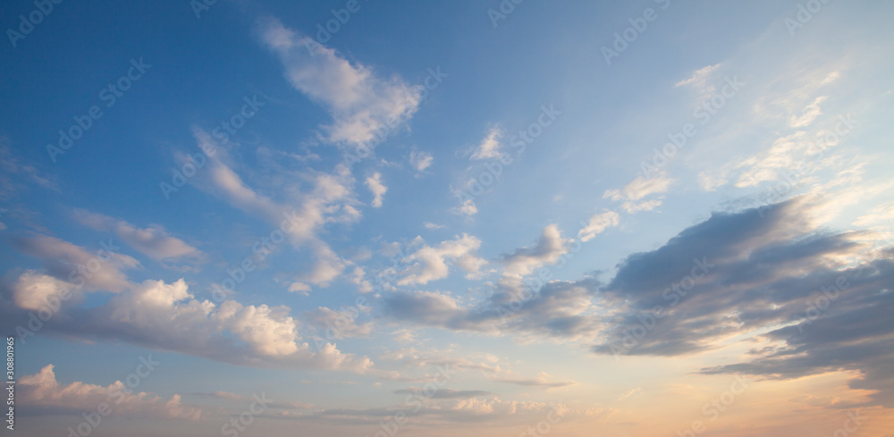 Blue sky clouds background. Beautiful landscape with clouds and orange sun on sky - obrazy, fototapety, plakaty 