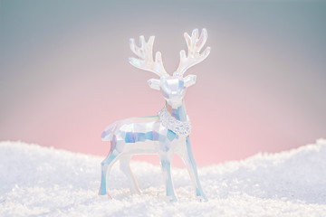 Wall Mural - christmas deer toy figurine in cold pastel light colors.