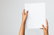 Woman of color holding a letter size or A4 brochure mockup