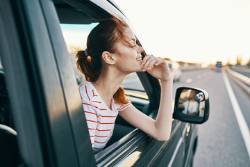 Wall Mural - young woman in car