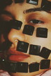 © Alp Peker - Close up of keyboard keys on woman's face