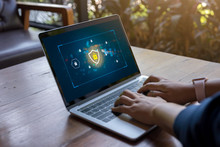 Person Using A Laptop Computer With Data Protection, Cyber Security, Information Safety And Encryption Concept. Internet Technology And Business Concept, Laptop Mockup With Clipping Path On Screen.