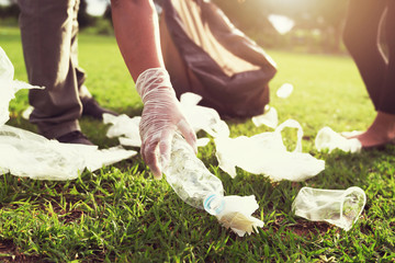 Wall Mural - people volunteer keeping garbage plastic bottle into black bag