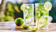 two mojito cocktails on wooden table top