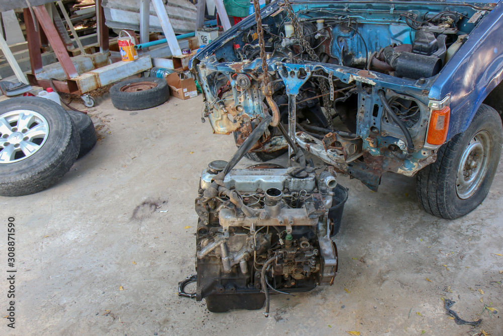 The Old Car engine on crane hook in garage repair service, outdoor ...