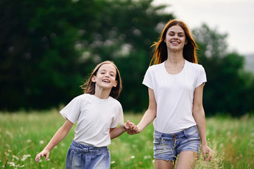 mother and daughter having fun in park