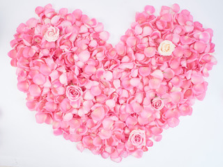 Wall Mural - Heart symbol made of pink rose petals.